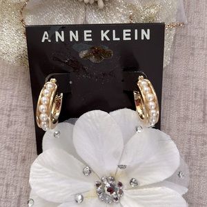 Anne Klein Small Hoop Gold Toned Earrings with Pearl Stones within the Middle.